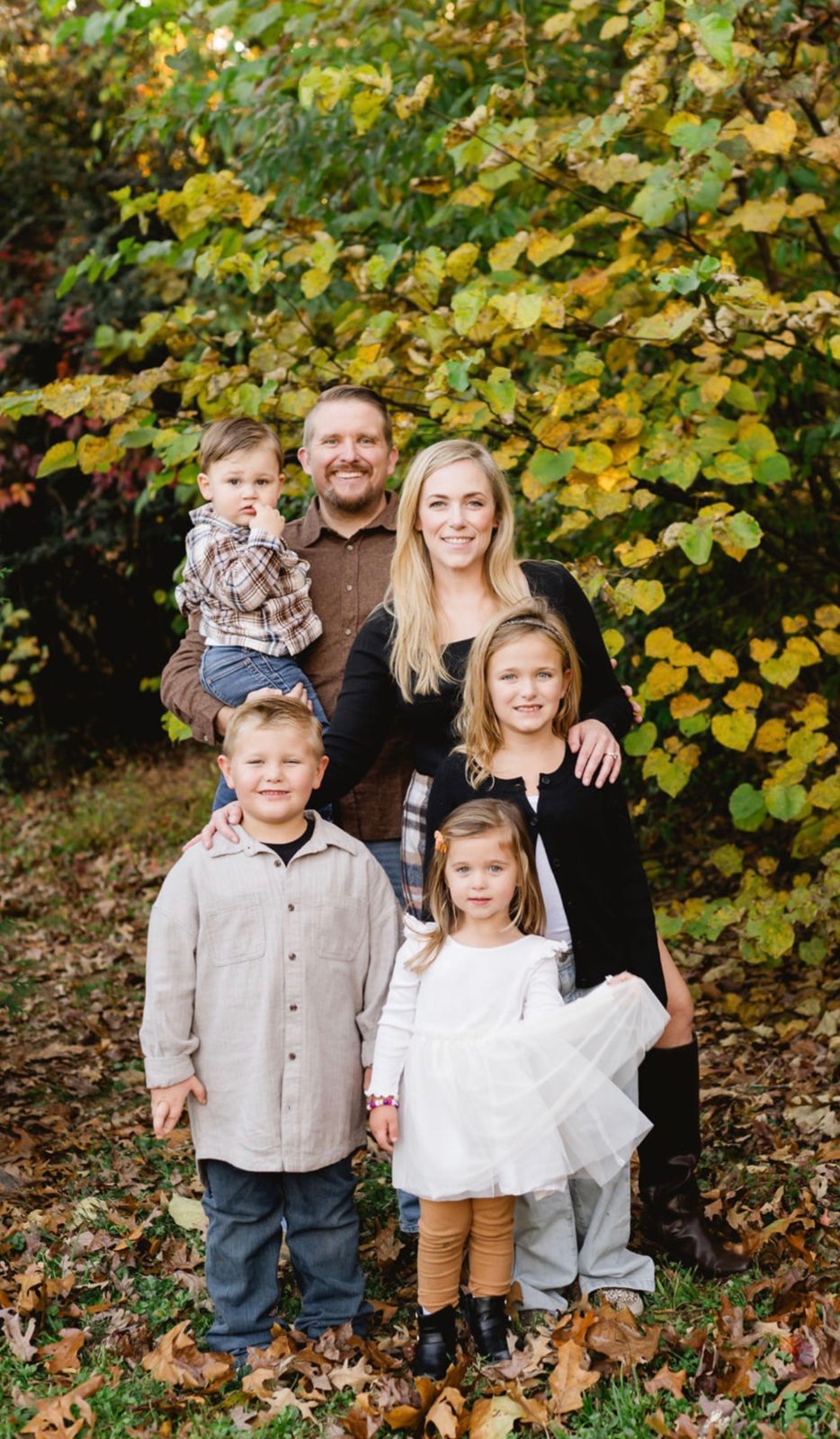 A family portrait in the fall leaves